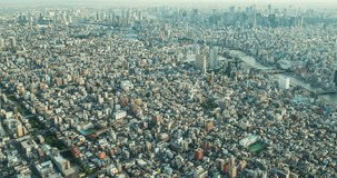 TOKYO, JAPAN – JUNE 2016 : Timelapse over central Tokyo cityscape at daytime from Sky Tree Tower with river and traffic in view