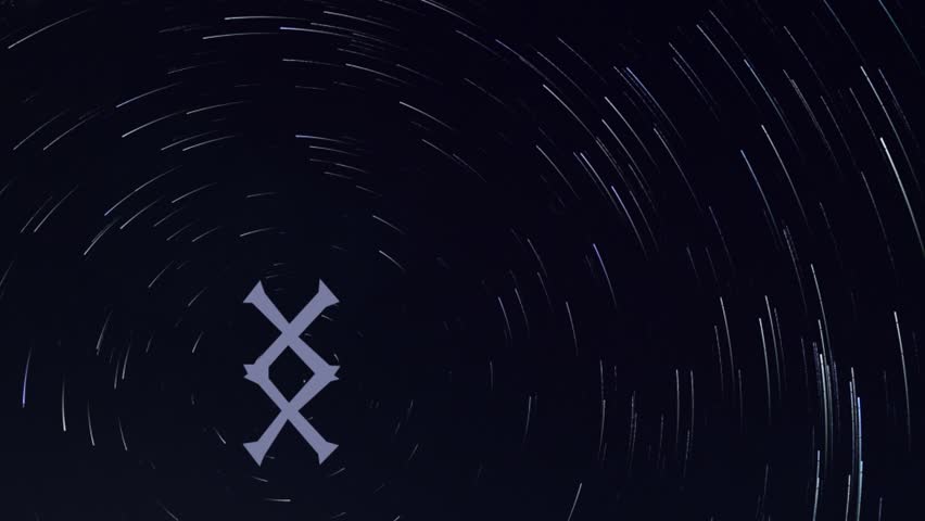 video of a Star trail in the background, 
with in the foreground the image of a rune 
moving towards the polar star of the same star trail, 
the rune in this clip is Inguz