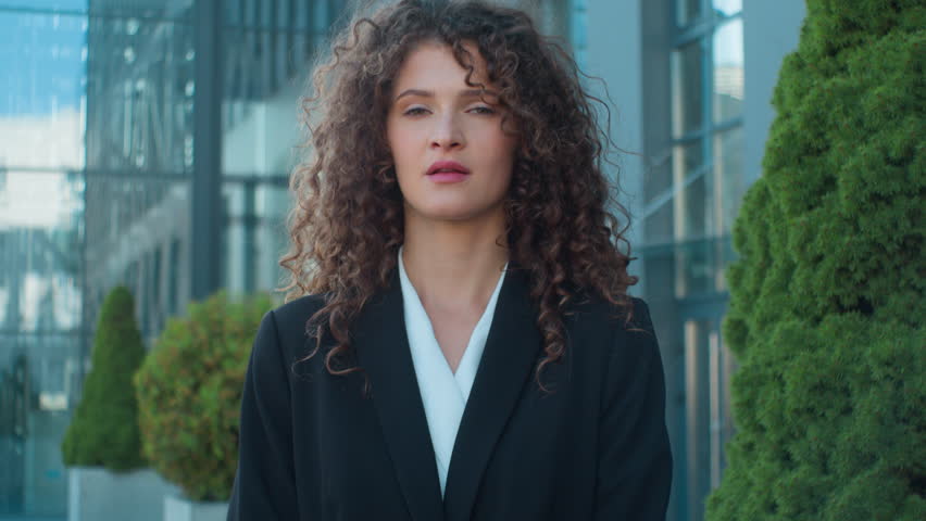 Outdoor portrait Caucasian woman dissatisfied disappointed businesswoman negative waving shaking head answer no never not rejection disagreement in city confident business girl deny prohibit refuse