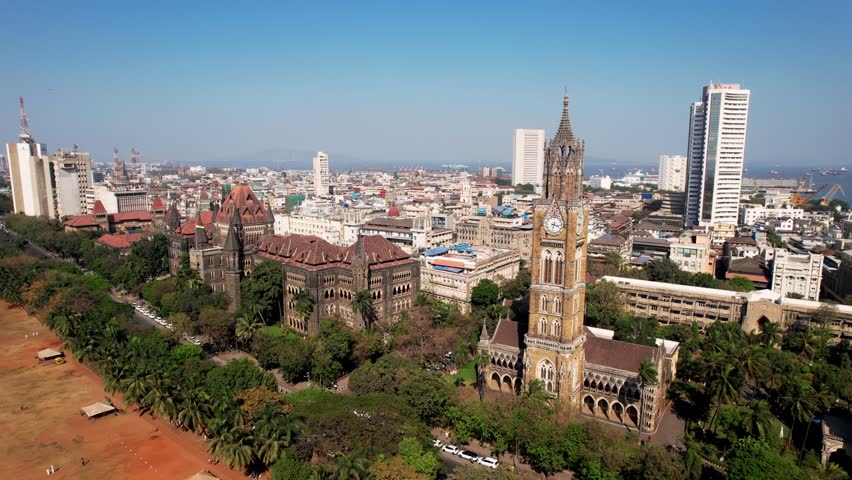 Aerial view of Rajabai Clock Tower in Mumbai, India, Colaba district. 1878 clock tower modeled after Big Ben. Victorian architecture in India.