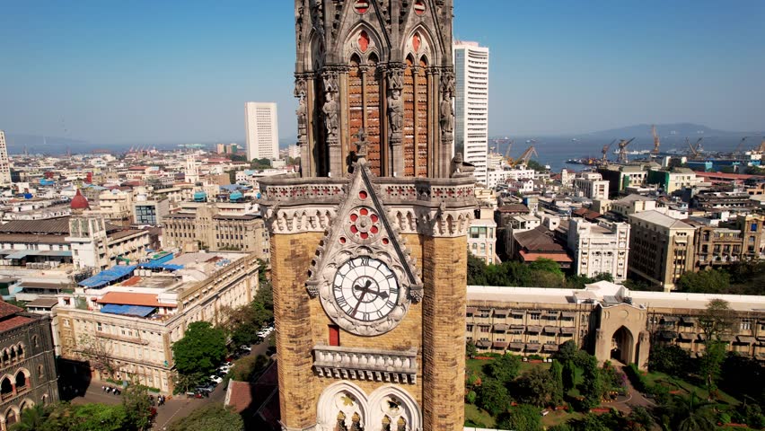 Rajabai Clock Tower in Mumbai, India, Colaba district, Aerial view. Victorian architecture in India. 1878 clock tower modeled after Big Ben. 