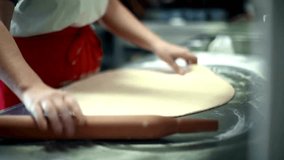 Homemade Pizza Preparation: 4K Closeup of Woman Rolling Dough on Flour Surface