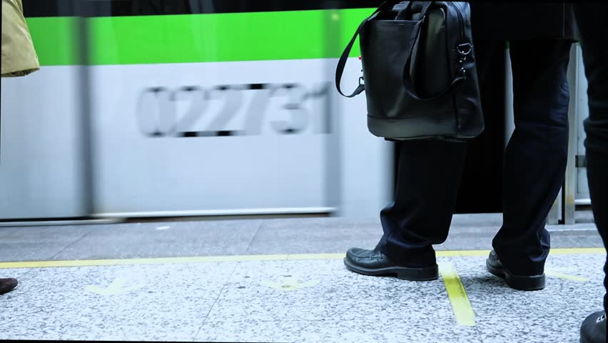 People standing waiting for the subway