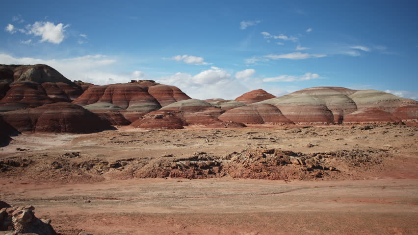 Aerial flyover view of landscape approaching colorful bentonite hills, caineville, utah, united states - Powered by Shutterstock - Get 15% off with code: PIKWIZARD15