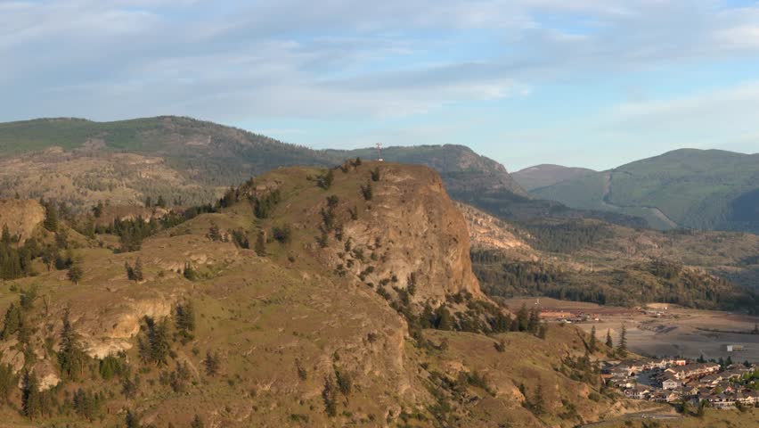 Aerial footage. Communication base stations and antennas on a mountain top in. 