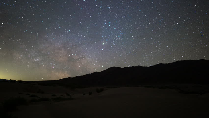 Timelapse of Milky Way galaxy over Mesquite Flat Sand Dunes at Badwater Basin in Death Valley National Park in California, USA