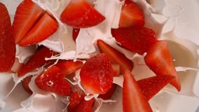 Super Slow Motion Shot of Fresh Strawberries Followed by Camera Falling into Cream at 1000fps. - Powered by Shutterstock - Get 15% off with code: PIKWIZARD15