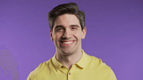 Headshot friendly man smiling,confident happy guy portrait,white teeth on violet - Powered by Shutterstock - Get 15% off with code: PIKWIZARD15