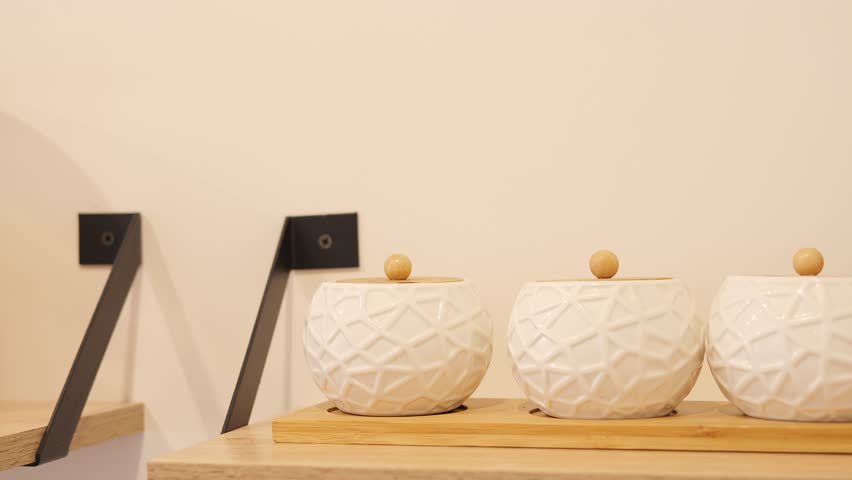 Containers for food storage neatly arranged on kitchen shelf. Keep your kitchen organized with our versatile containers. Explore our container collection today. Kitchen food storage concept