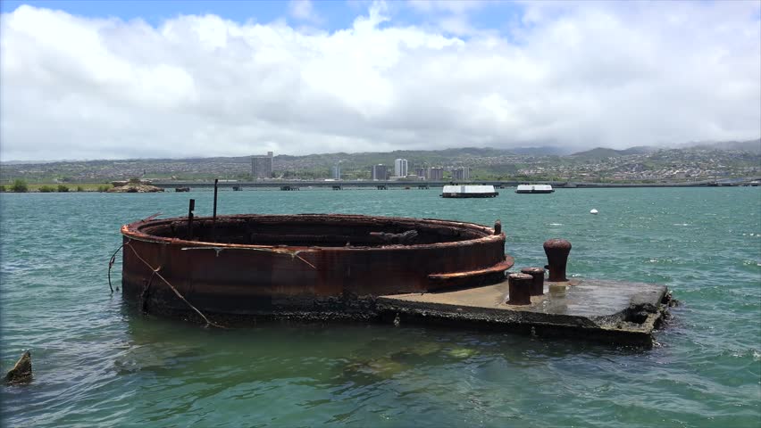 Remains of a sunken battleship above the surface of the water at USS Arizona Memorial. Pearl Harbor.Oahu, Hawaii, USA