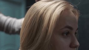 a beautiful young girl with short hair and a bob haircut is doing a procedure in a beauty salon. Master hairdresser doing coloring and tinting of client's hair close-up - Powered by Shutterstock - Get 15% off with code: PIKWIZARD15