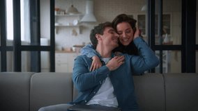 Caucasian girl female woman girlfriend wife going from home kitchen to working freelance laptop using man guy male husband boyfriend stop work hugging cuddling couple talking smiling laughing love - Powered by Shutterstock - Get 15% off with code: PIKWIZARD15