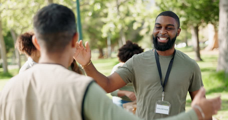 Park, volunteering or happy people hug for support, community project or donation for nature sustainability. Humanitarian, handshake and proud friends celebrate with smile, charity service or NGO