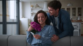 Caucasian man love guy male husband boyfriend walking go to lovely woman girl female using mobile phone app surprise gift give flowers roses to girlfriend boyfriend anniversary romantic hug at home - Powered by Shutterstock - Get 15% off with code: PIKWIZARD15