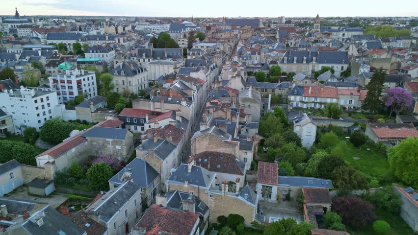 Modern neighborhood of Poitiers city, France. Aerial drone forward at sunset