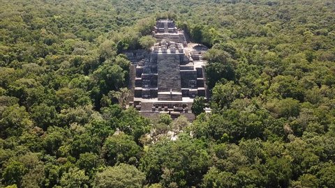 Aerial video flying towards the mayan Calakmul Temple in the Mexican Yucatan. The mayan ruins at Calakmul, Mexico