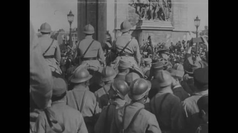CIRCA - 1919 - French and allied infantry march in a Victory Parade after the end of WWI down the Champs-\xCC\xE4lys?es in Paris, France.