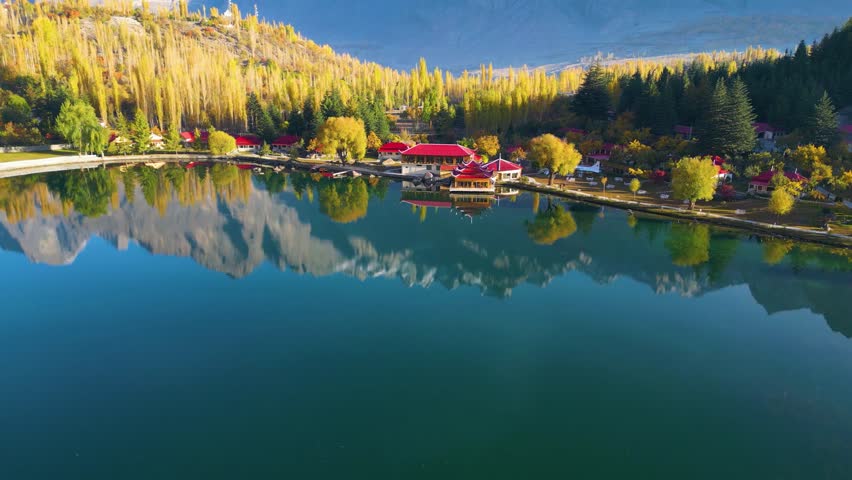 Aerial View Over Calm Reflective Lower Kachura Lake, also known as Shangrila Lake Near Skardu In Gilgit−Baltistan, Pakistan. Orbit Motion Shot