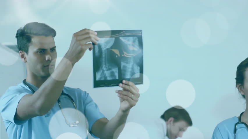 Animation of data processing over diverse doctors. Global medicine, connections, computing and data processing concept digitally generated video.