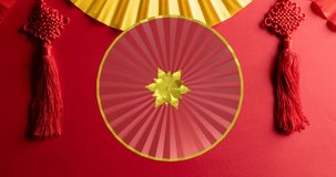 Animation of happy chinese new year text over chinese pattern on red background. Chinese new year, festivity, celebration and tradition concept digitally generated video.