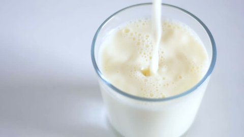 Pouring milk in a glass