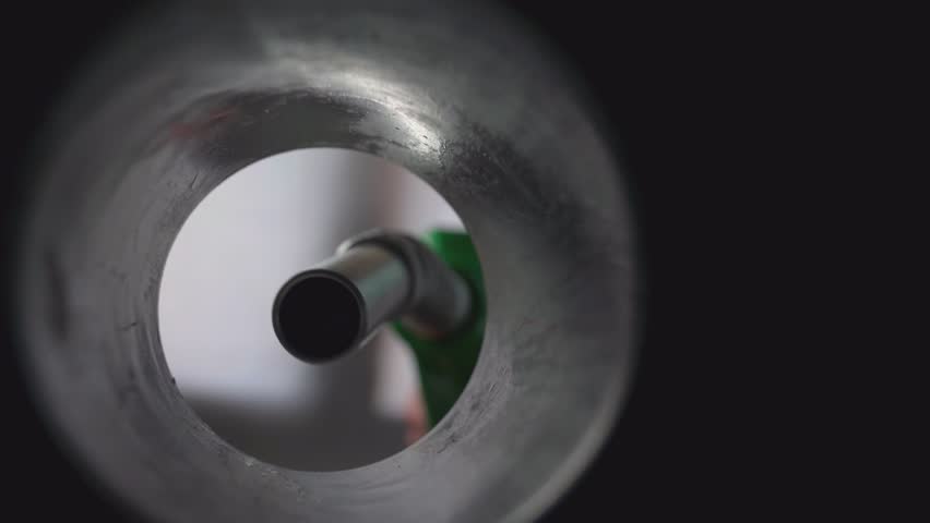 Filling the tank of the vehicle with fuel. Inside view of the fuel tank