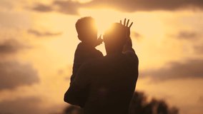 Father care is important kid toddler for healthy family. happy family kid concept. The silhouette of the father holding the son was visible in the sunshine dream. father and son in a forest park - Powered by Shutterstock - Get 15% off with code: PIKWIZARD15
