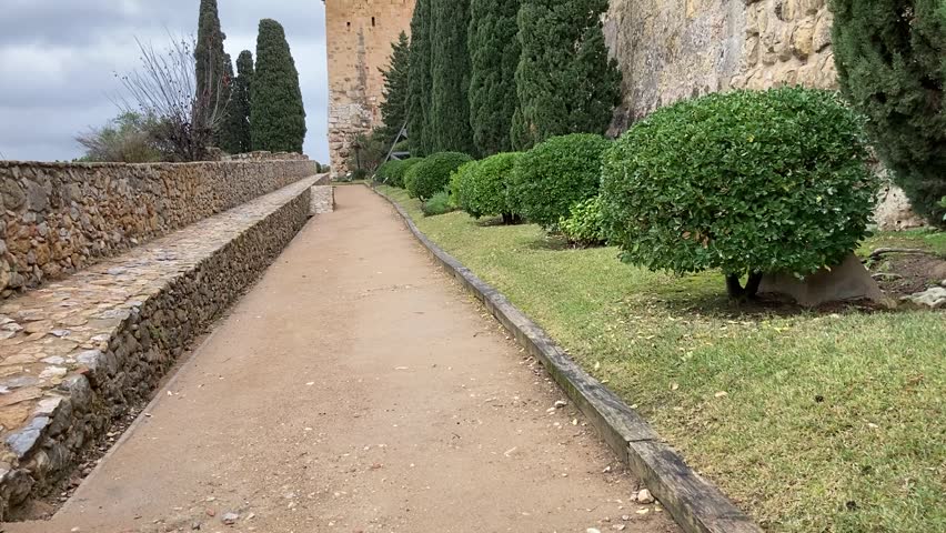 Tarragona Roman walls tree lined with tower   