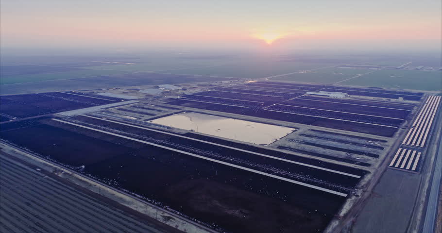 Aerial: Flying over large industrial scale cattle ranch in Bakersfield, California