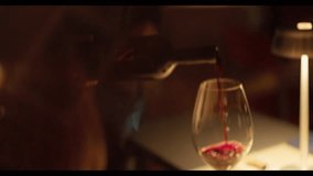 Waiter Pours Red Wine Into Glass For Guests. - Powered by Shutterstock - Get 15% off with code: PIKWIZARD15