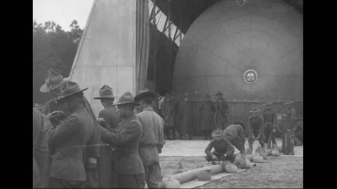 CIRCA - 1918 - Soldiers inflate and release an airship, during coastal artillery training for WWI.