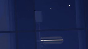 glass facade of a modern business center. Abstract modern business architecture. Blue sky and clouds reflected in structural modular glass wall. Vertical video. - Powered by Shutterstock - Get 15% off with code: PIKWIZARD15