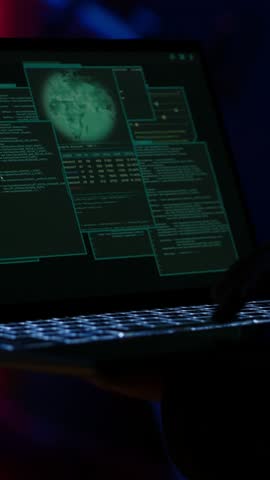 Vertical video Hacker arriving in secret base with laptop, ready to start programming viruses. Scammer in criminal den opening notebook to exploit network servers and bypass security measures, camera