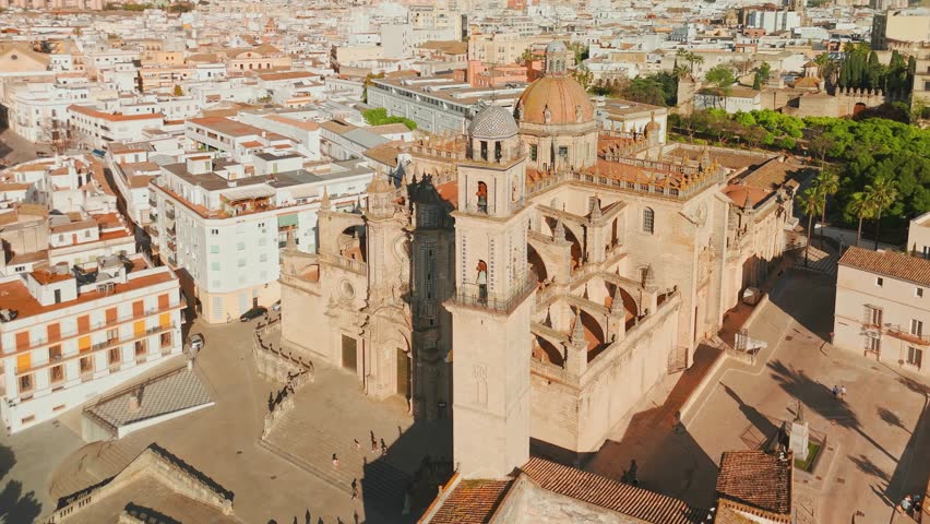 Aerial view of Jerez de la Frontera town in Andalusia, Spain. Jerez Cathedral and historic Moorish Alcazar de Jerez de la Frontera at sunset in Andalucia