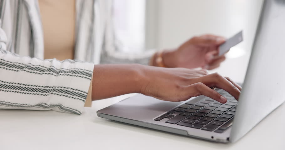 Business, woman and typing on laptop with credit card for details or pin, online shopping and subscription services or sale. Girl, technology and website for ecommerce, banking investment and payment