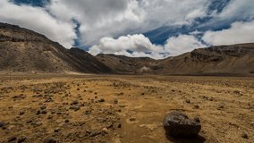 Time lapse of clouds passing over the volcanic landscape inside the south crater at the Tongariro Alpine Crossing in New Zealand.