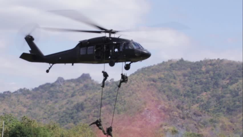 Soldiers sprang from the helicopter.