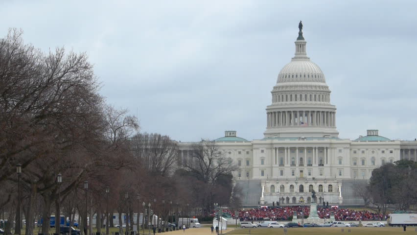WASHINGTON DC - MARCH 3: Participants in the 100th anniversary of Washington’s Women’s Suffrage Parade rally at steps of the US Capitol March 3, 2013 in Washington DC, USA