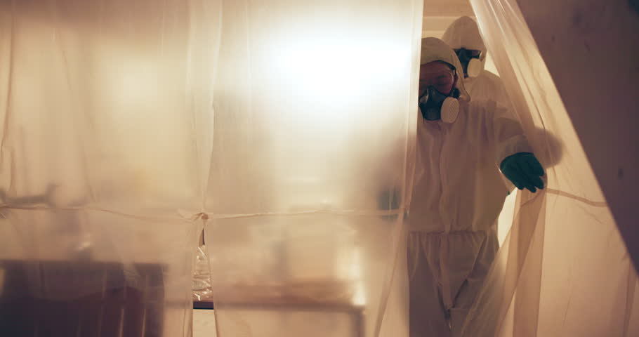 People, hazmat suit and walking in lab, biohazard and ready to leave work for danger or health. Team, finish task and protective overalls for safety, quarantine and procedure for toxic pollution