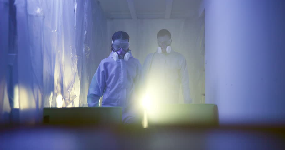 People, hazmat suit and chemical tank in lab, biohazard and cleaning danger waste or liquid. Team, help and protective overalls for safety, disinfection and emergency procedure for toxic pollution