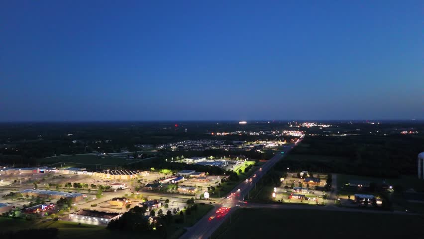 Drone following Lexington road leading to the city of Nicholasville, Kentucky while hovering over Brandon crossing shopping complex.