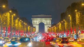 4K Timelapse of traffic at Arc de Triomph at night. This historical monument overlooks the avenue des champs élysées in the heart of Paris, French capital. - Powered by Shutterstock - Get 15% off with code: PIKWIZARD15