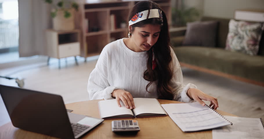 Woman, laptop and confusion for paperwork in home, budget and accountant for audit information. Female person, online tax website and doubt for documents, planning and mistake on finance report