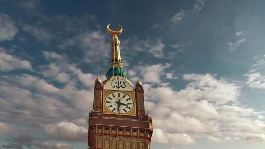 Mecca, Saudi Arabia with Abraj Al Bait (Royal Clock Tower Makkah) Translation: "there is no god but allah and Prophet Muhammed (s.w.a) is his messenger. Time Lapse at Sunset Mecca city Clock Tower