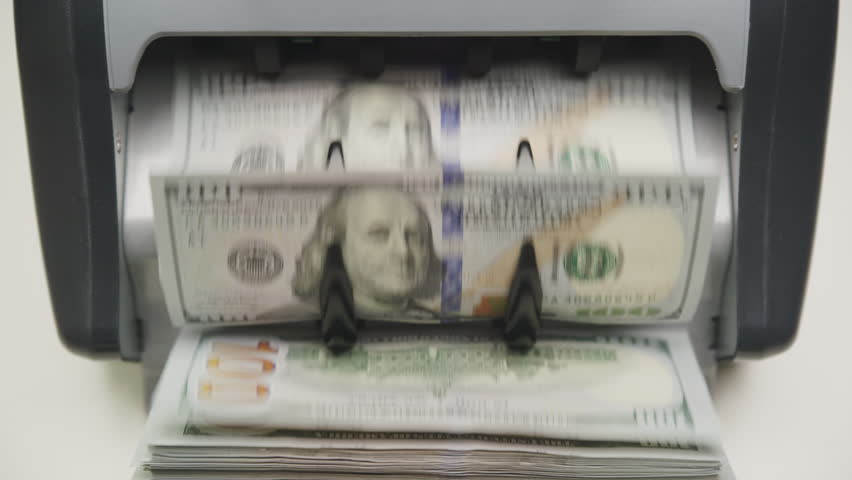 Hundred Dollar Bills Being Counted in Cash Machine - Powered by Shutterstock - Get 15% off with code: PIKWIZARD15