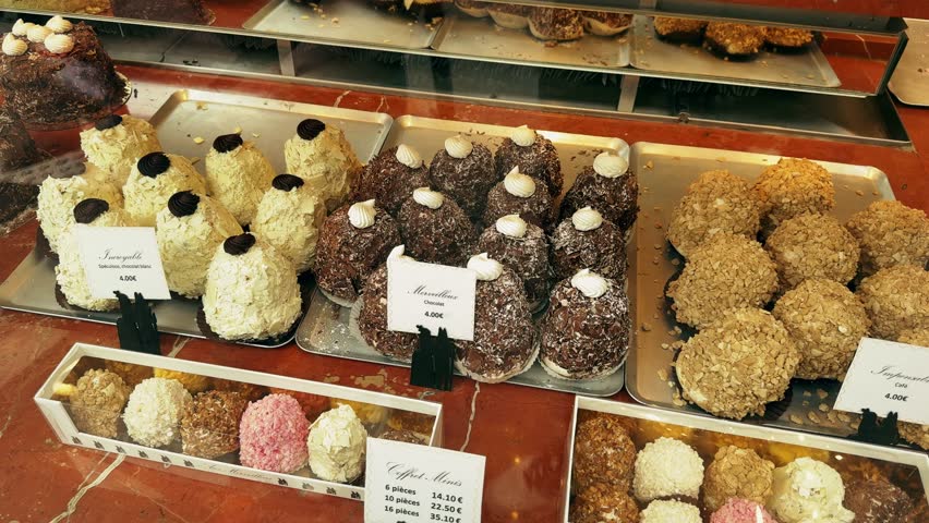 Delicious sweets pastries in patisserie cafe. Showcase of bakery close-up.