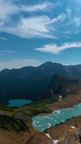 Vertical 4k Timelapse, Glacier National Park Montana USA. Lookout on Glacial Lake With Ice and Majestic Vista on Sunny Summer Day