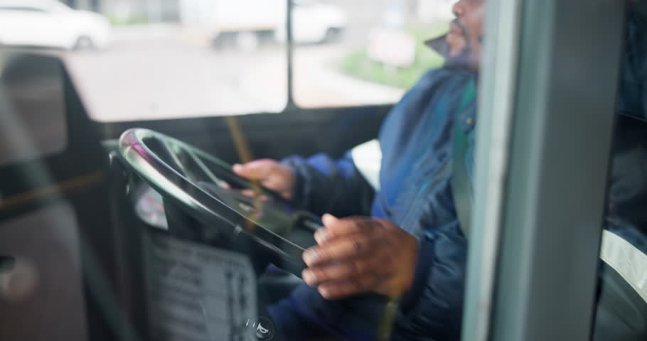 Bus, driver and driving on road for transportation or commute passengers, trip and journey for public transit. Black man, steering wheel and control of vehicle for safety, route and motion for travel