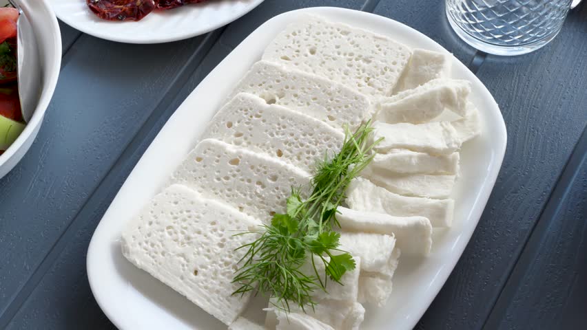 Top view organic diet food on the table. The camera moves over plates with pieces of white farmer