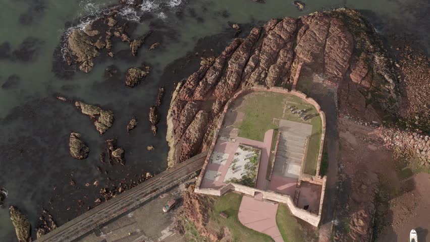 Aerial view of Dunbar Battery and rocky coast by the sea, East Lothian, Scotland.
